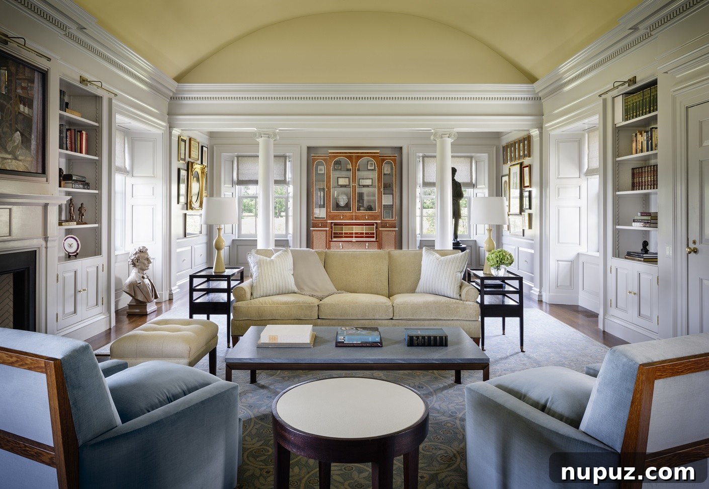 Expansive and elegant living room by Brady Design, featuring plush seating, a statement coffee table, and large windows that flood the space with natural light. Captured by Marco Ricca Photography.