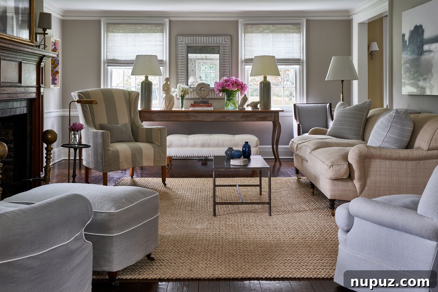 Bright and airy living room with a serene color palette, expertly designed to maximize comfort and natural light by Brady Design. Photo credit: Marco Ricca Photography.