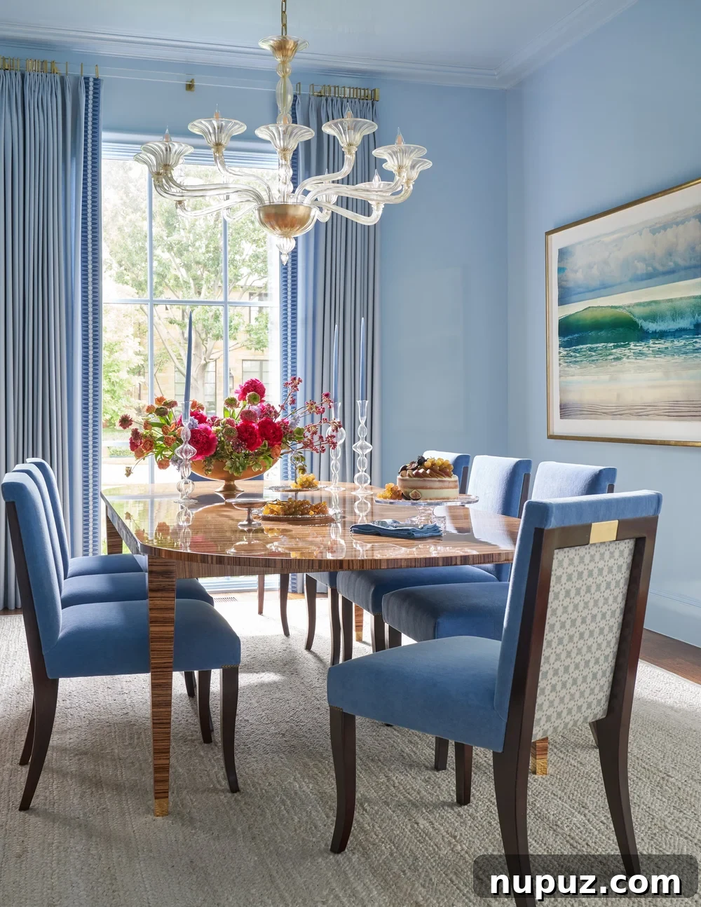 10 Exquisite Dining Rooms by Mary Beth Wagner 4 An inviting dining area with a circular table, delicate chairs, and a striking chandelier, illustrating Mary Beth Wagner's elegant design choices. Photographed by Nathan Schroder.
