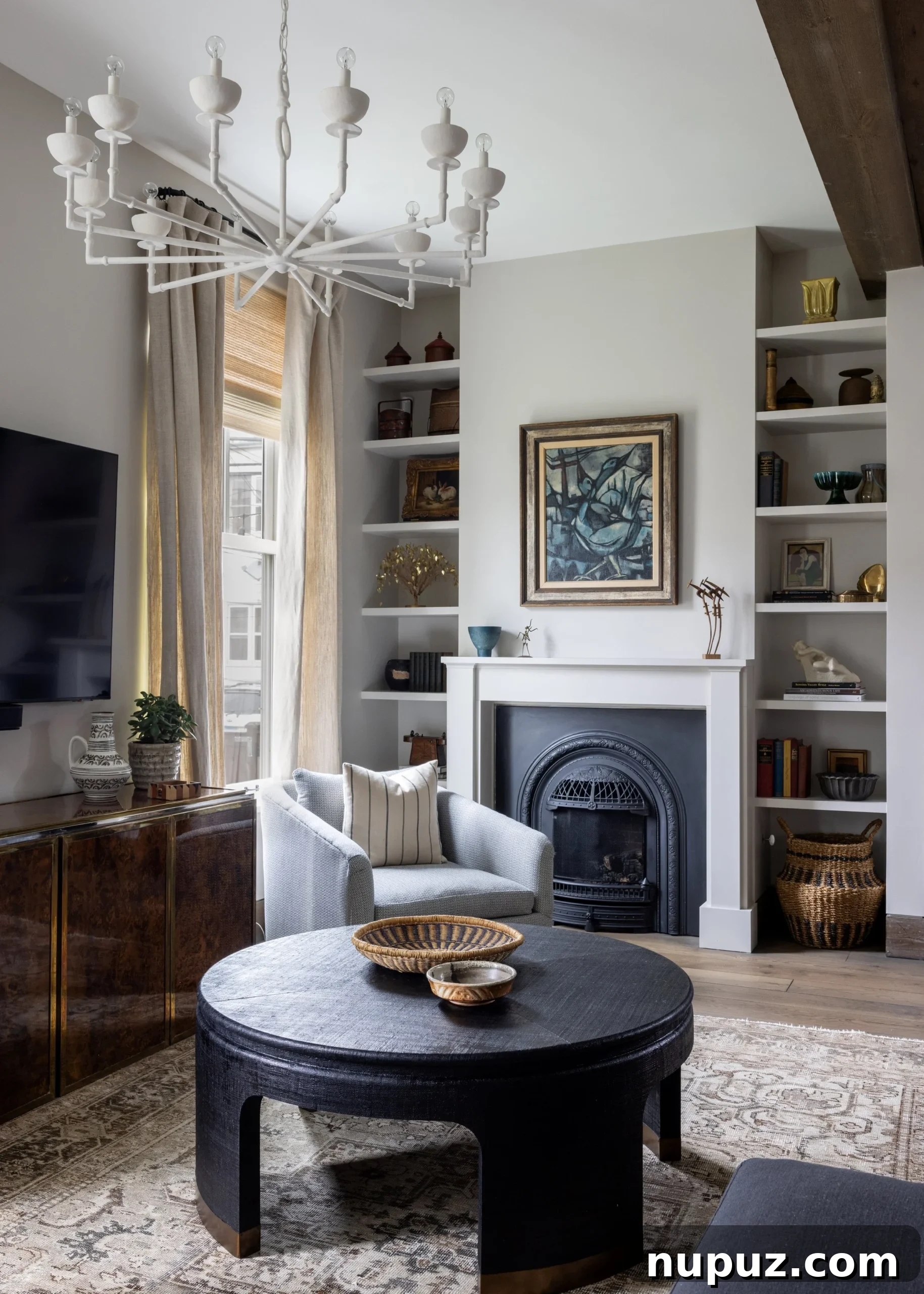 Elegant Imparfait Design Studio living room featuring plush armchairs, a classic console table, and subtle decorative accents.
