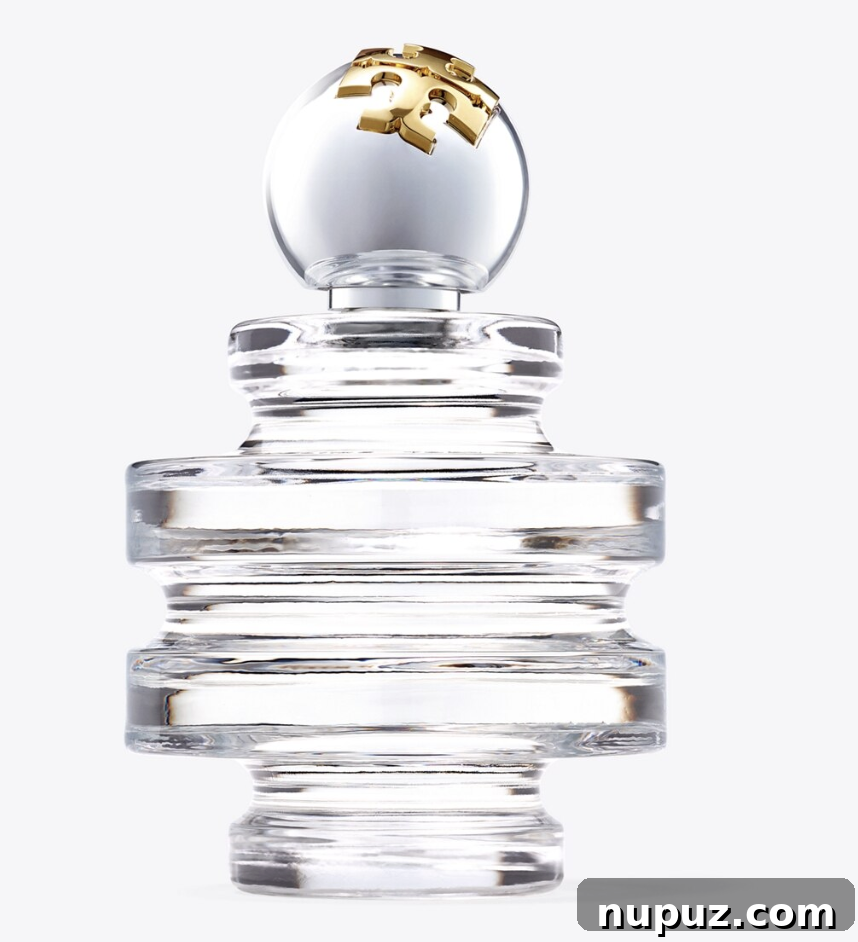 An image showcasing Tory Burch's elegant holiday gift guide, featuring stylish accessories