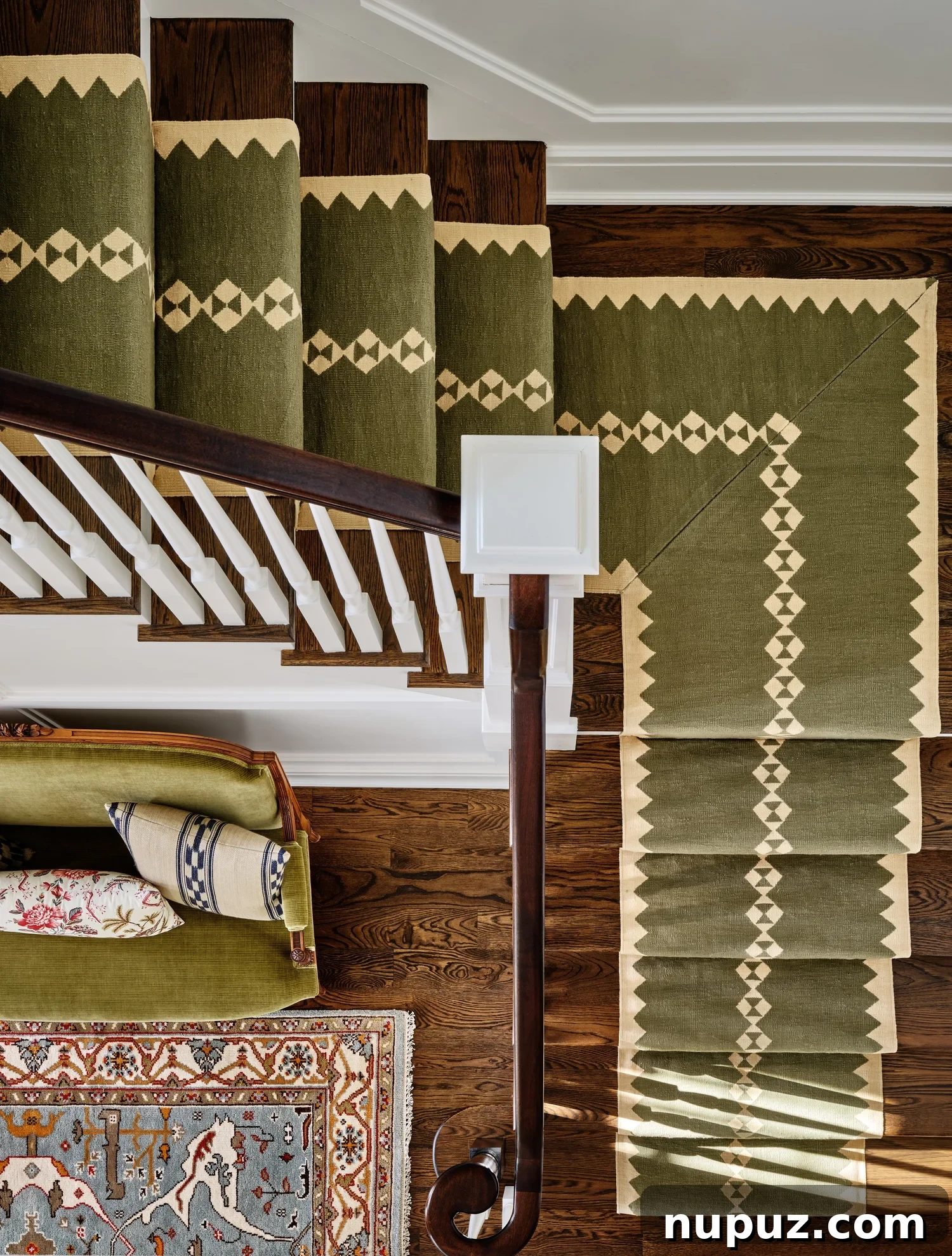 Home Goals: Design Your Best Year Yet 4 An elegant living room with a large, comfortable sofa adorned with an array of patterned throw pillows, demonstrating Ariel Okin's masterful layering technique.
