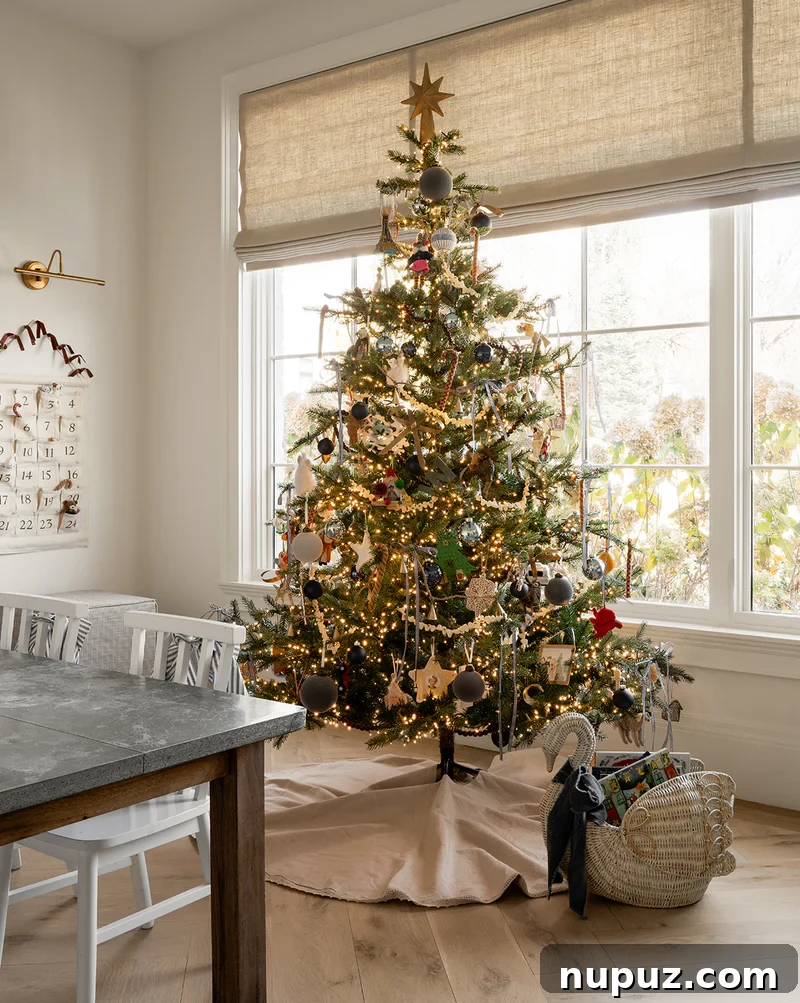 A beautifully adorned Studio McGee Christmas tree, showcasing lush greenery and delicate ornaments for a cozy holiday feel.