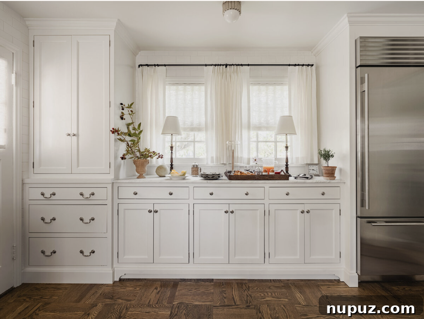 Sophisticated kitchen design by Marianne Simon Interiors, blending high functionality with high-end aesthetics, featuring custom cabinetry and a large island. Stylist @cate.ragan.styling Photography @_karamercer