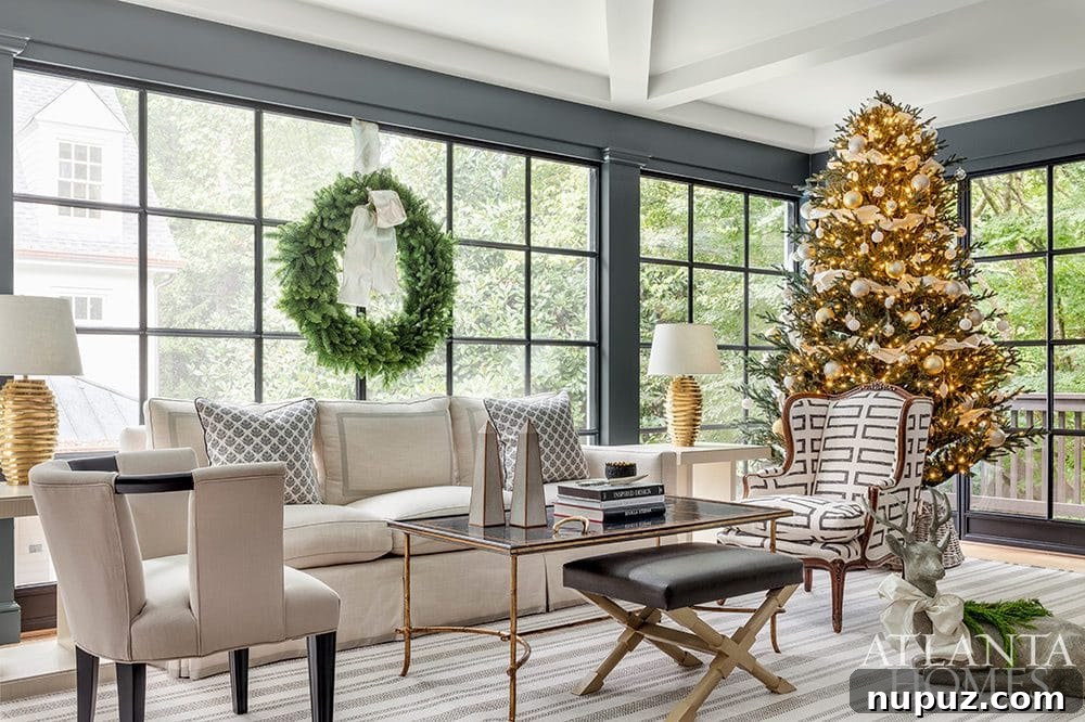 Inviting holiday living room with a classic fireplace, decorated mantle, and a festive Christmas tree. Design by Huff-Dewberry, Inc.