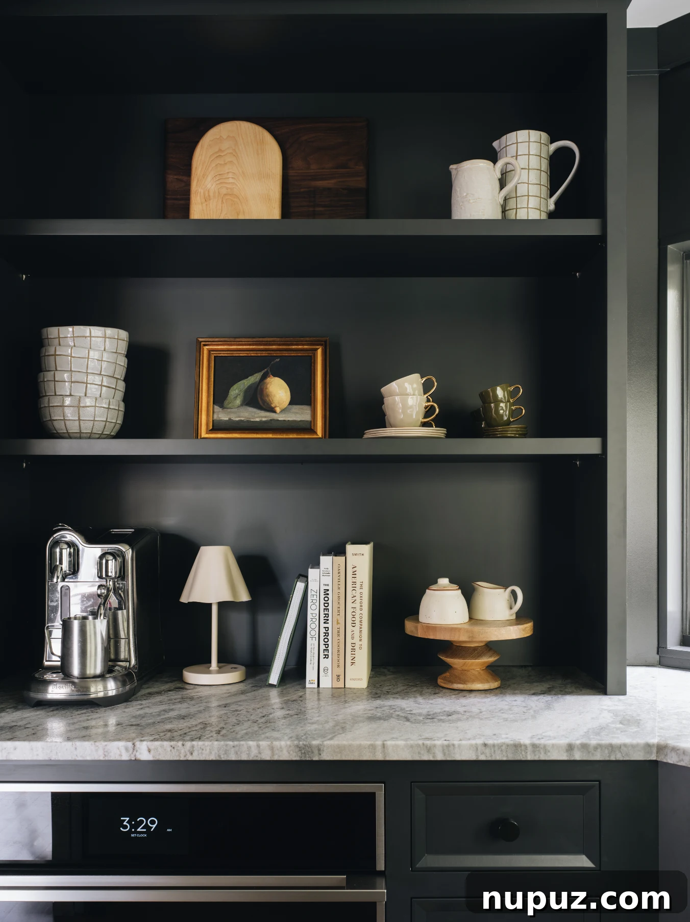 Designing Your Ultimate Home Coffee Bar 2 Elegant kitchen coffee bar with wooden cabinetry, a sophisticated coffee machine, and stylish decor, showcasing functional design inspired by Jean Stoffer.