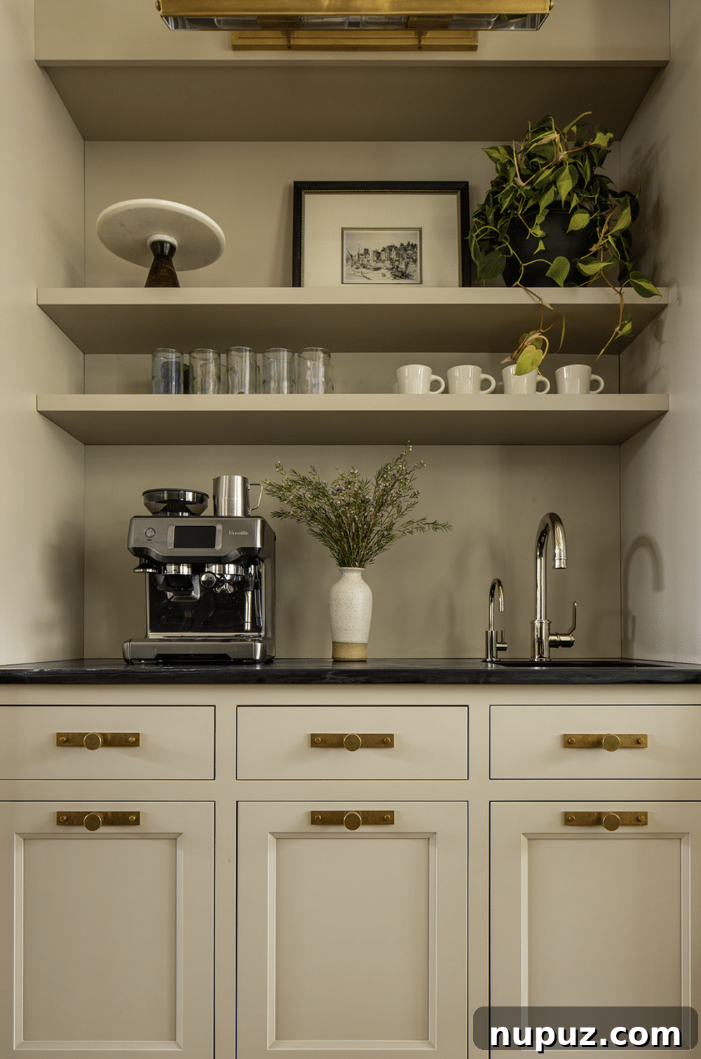 Designing Your Ultimate Home Coffee Bar 8 Organized coffee bar with elegant floating shelves displaying mugs and neatly arranged coffee supplies, demonstrating smart vertical storage.
