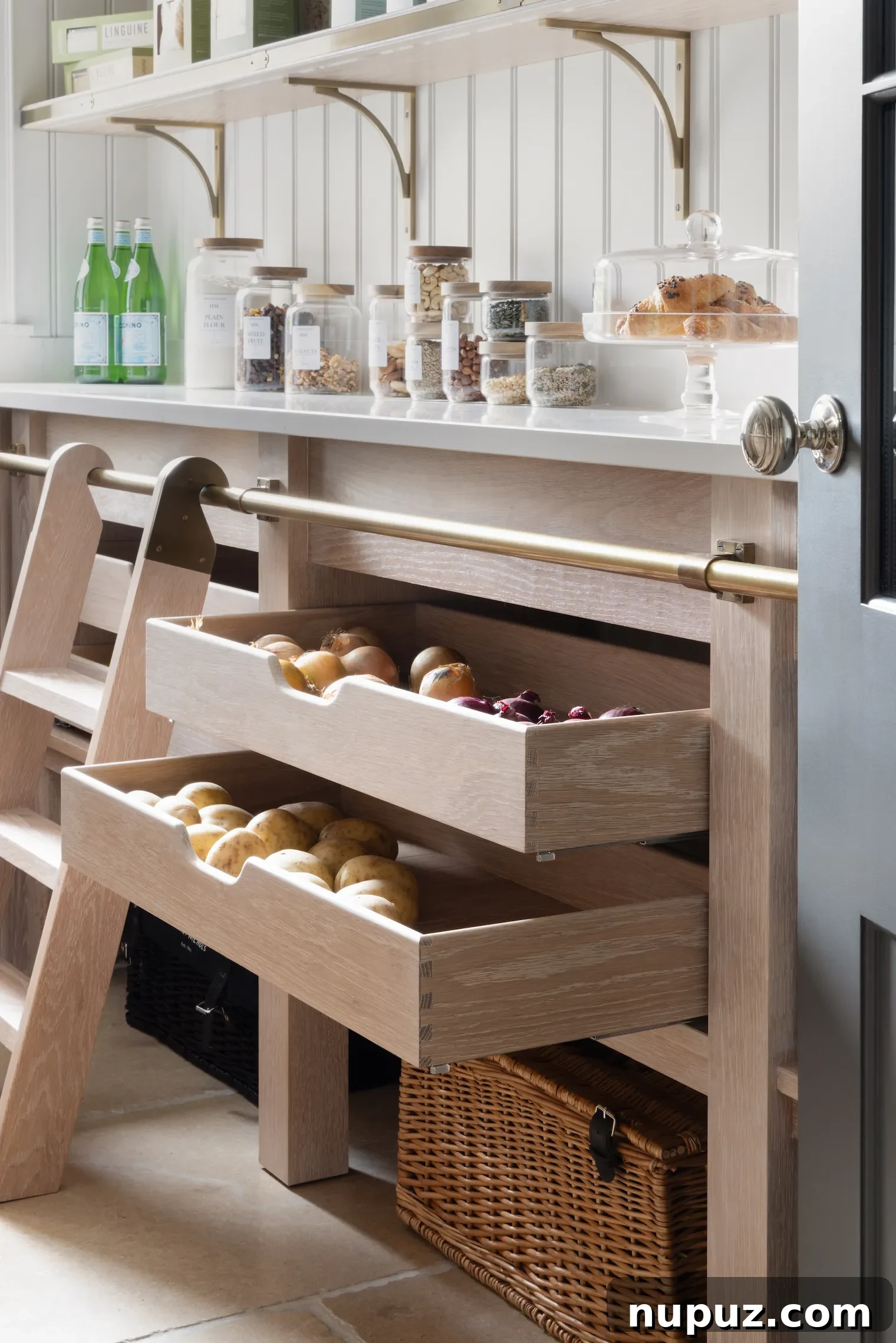 Interior of a Humphrey Munson kitchen drawer, showcasing customized storage for various kitchen essentials, photographed by Paul Craig.