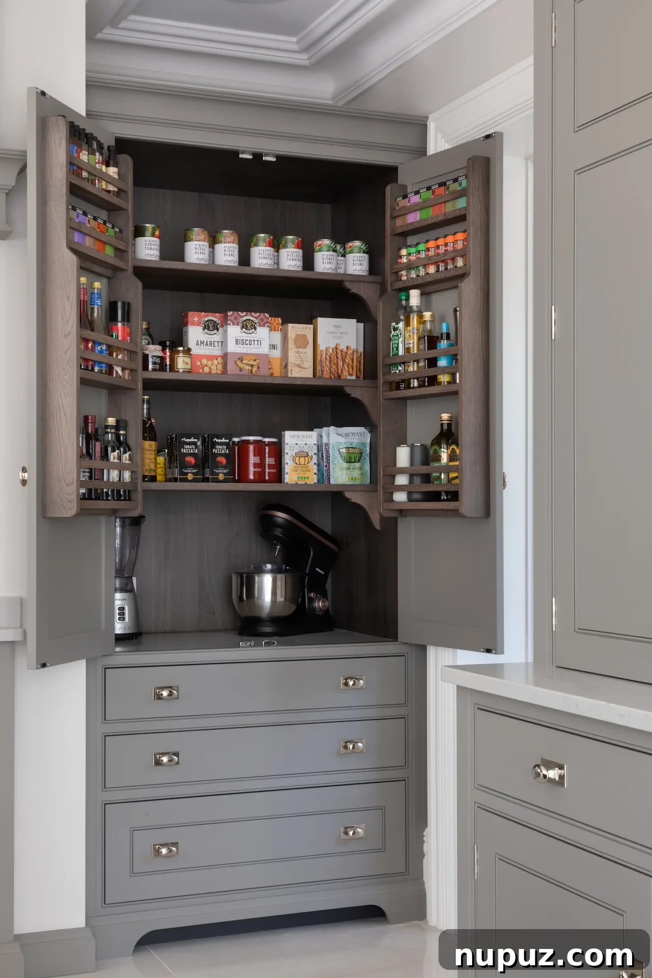 An interior view of a Humphrey Munson kitchen pantry featuring beautifully arranged spice jars, photographed by Paul Craig.