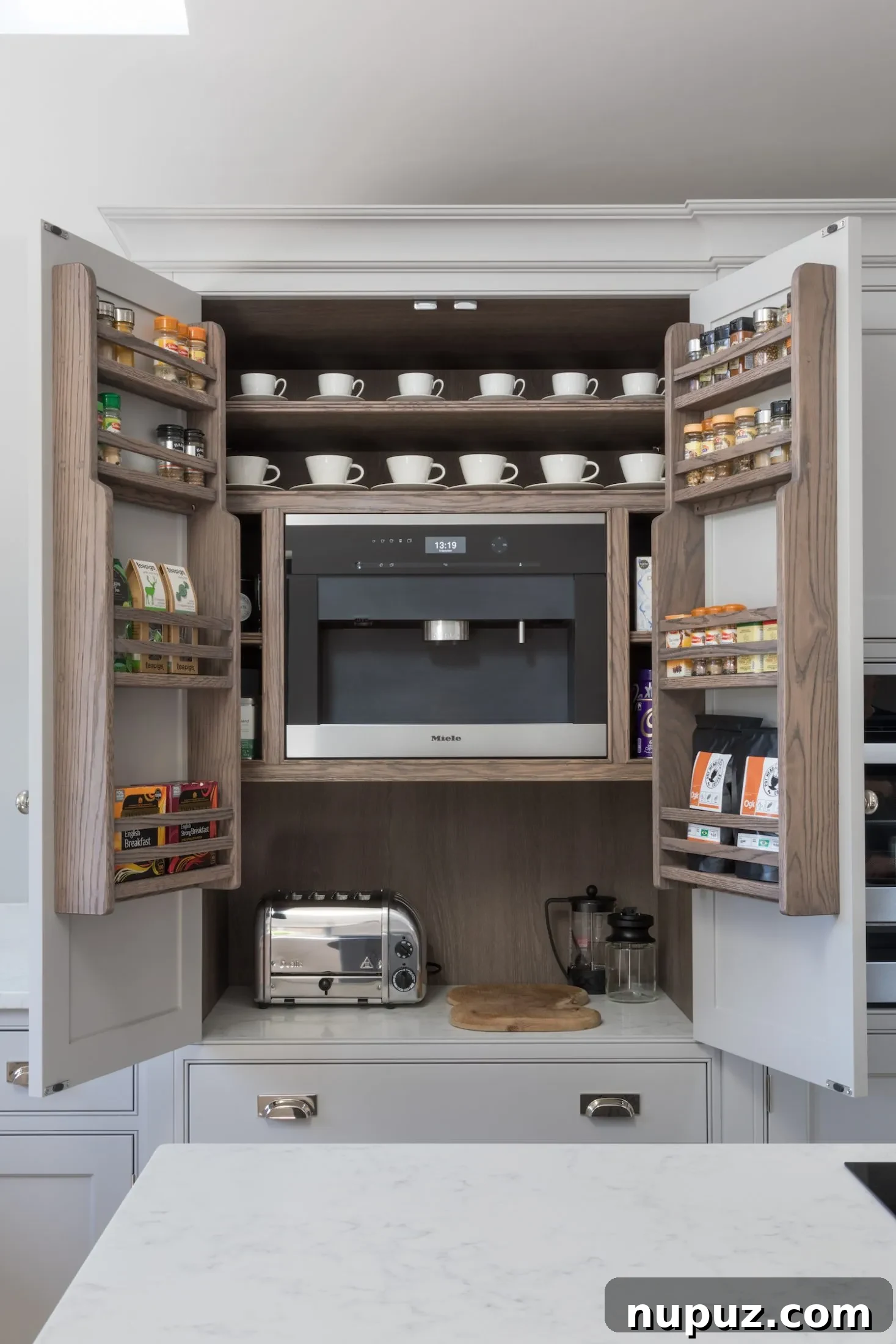 An elegant coffee bar setup within a Humphrey Munson kitchen, perfect for a luxurious morning ritual, by Paul Craig.