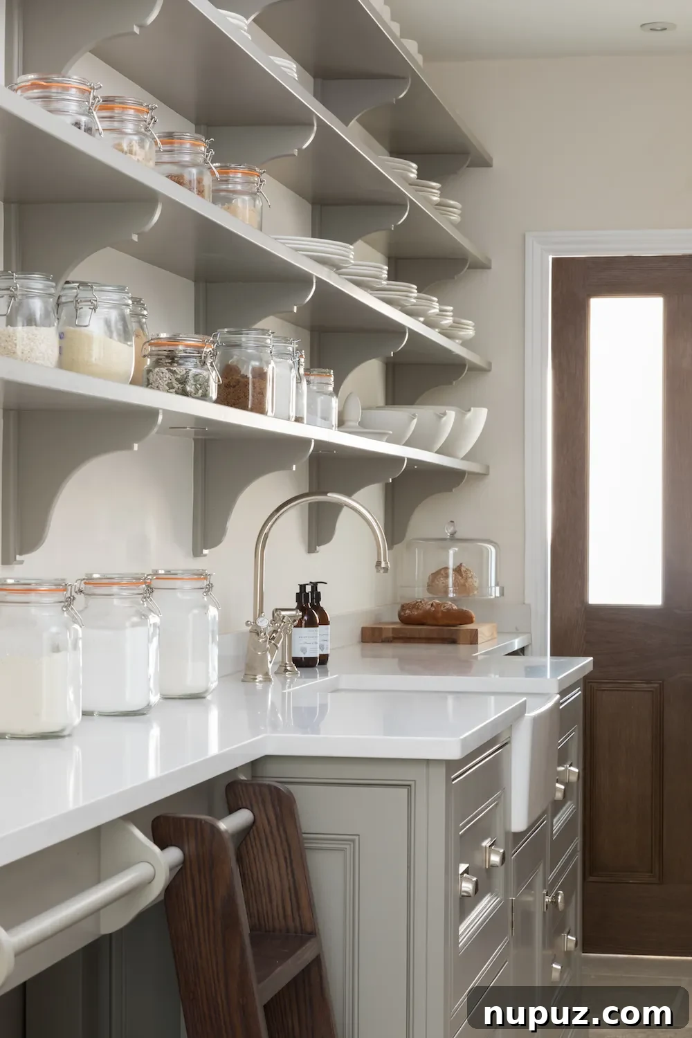 Showcasing comprehensive storage solutions in a Humphrey Munson kitchen, illustrating their 'place for everything' philosophy, by Paul Craig.