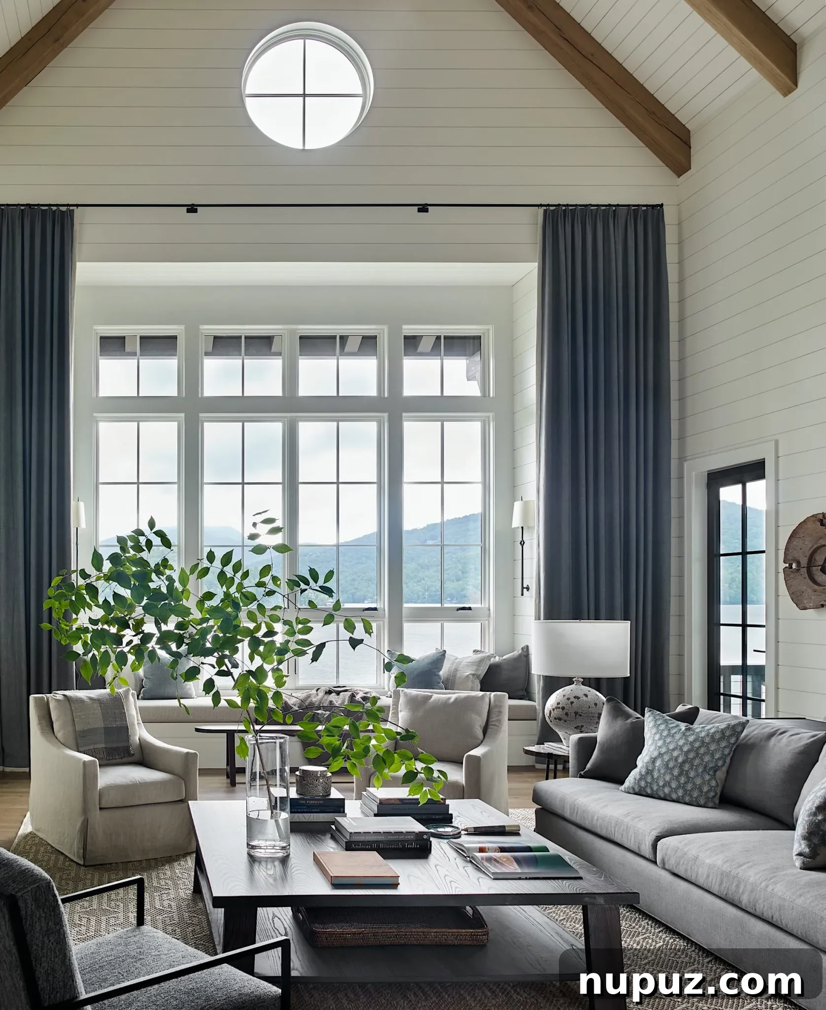 Luxurious living room featuring elegant drapes, classic seating, and refined decor by Design Atelier, photographed by Emily Followill.