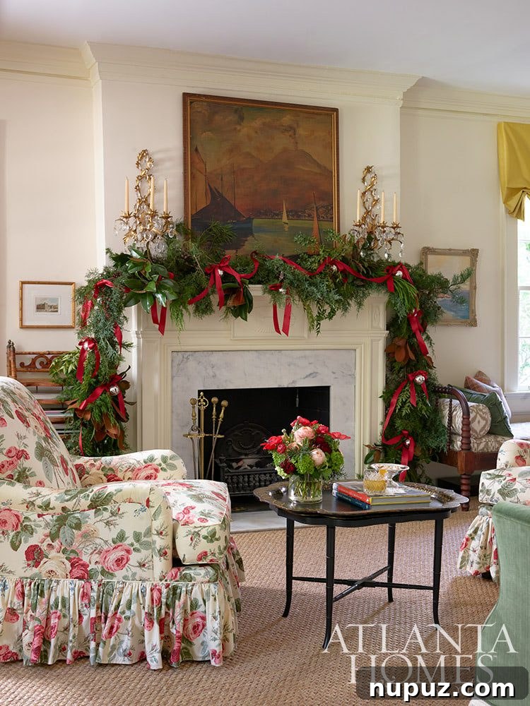 Elegant Christmas mantel with a lush cedar and magnolia garland, festive ornaments, and classic gold accents, designed by Clary Bosbyshell.