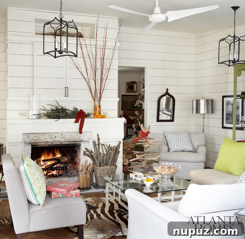 A simple yet elegant Christmas mantel with a green garland and festive ornaments, creating a welcoming holiday atmosphere.