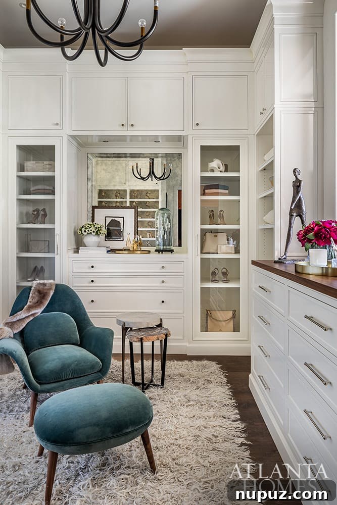 Elegant walk-in closet with dark wood built-ins and sophisticated lighting