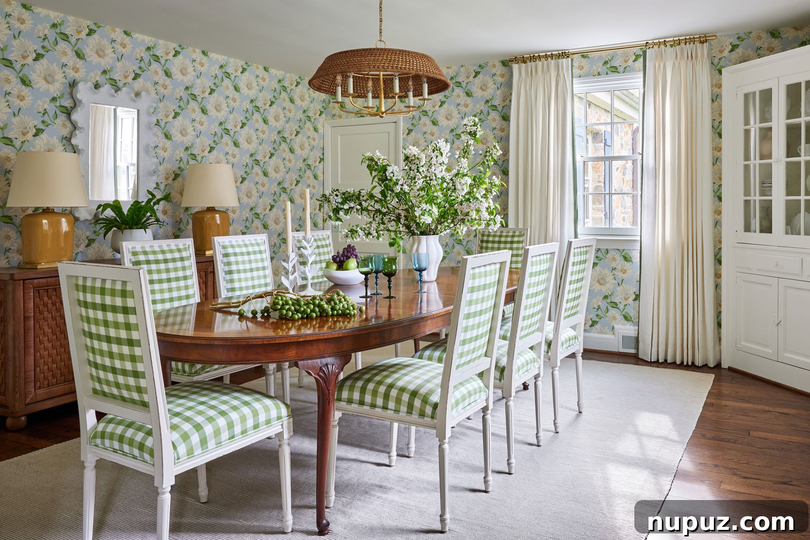 Inspiring Interiors: Designs That Breathe Freshness 3 A beautifully appointed dining area by Jennifer Hunter Design, showcasing a harmonious blend of traditional furniture with contemporary art, under exquisite lighting. Photo by Kirsten R Francis, styling by Frances Finds.