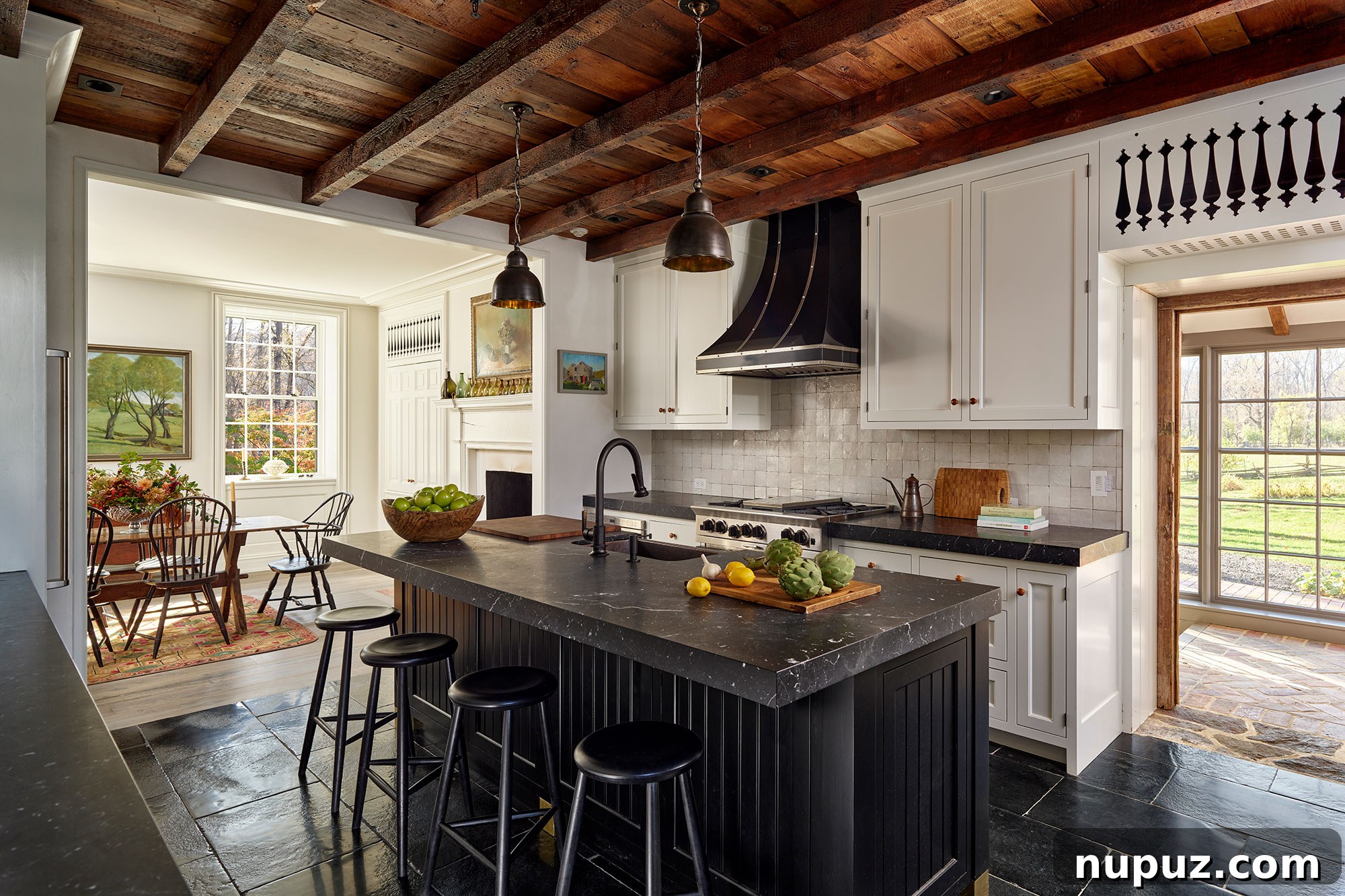 Fresh Interior Aesthetics for 2026 11 A stunning farmhouse kitchen with exposed wood beams, natural wood, and blackstone countertops.
