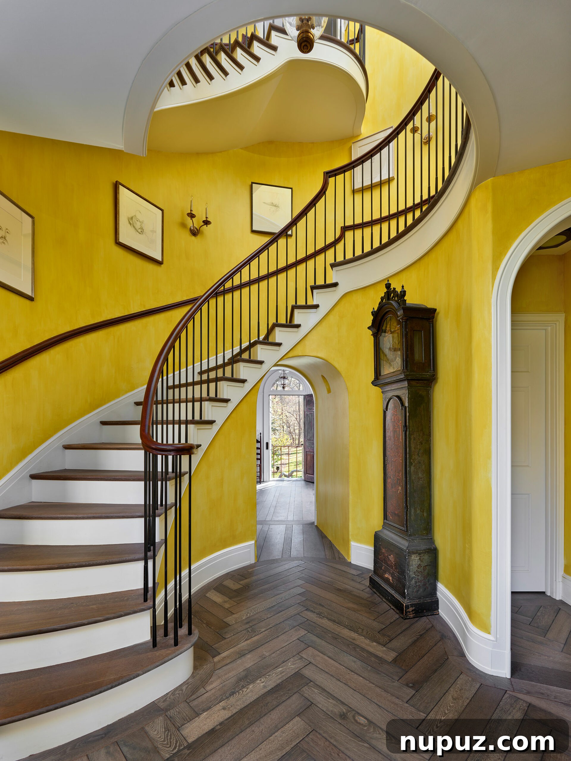 Fresh Interior Aesthetics for 2026 4 A majestic foyer with a beautiful circular staircase, a hallmark of Archer & Buchanan's design.