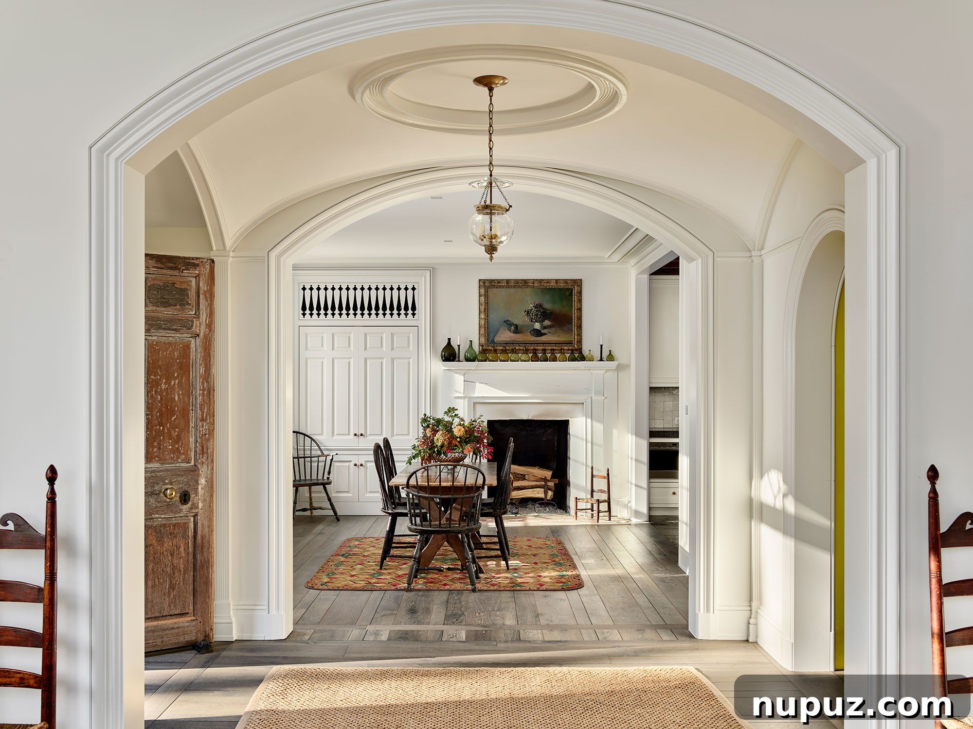 Fresh Interior Aesthetics for 2026 9 Charming farmhouse dining room with classic Windsor chairs, perfect for family gatherings.