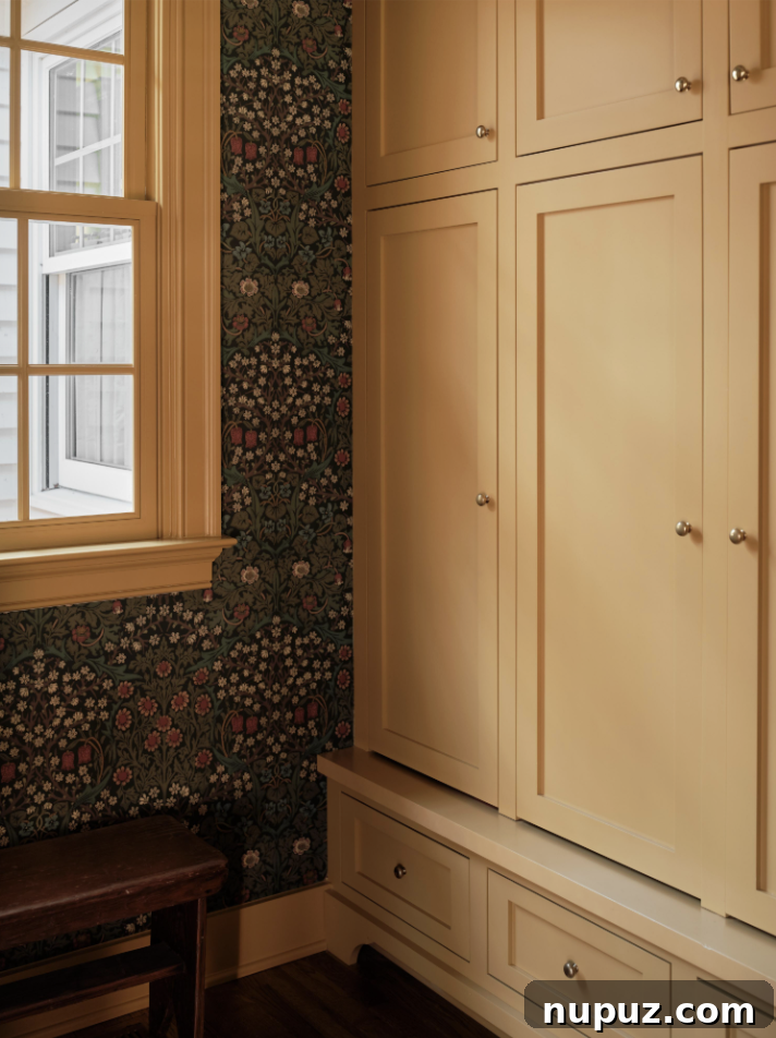 A perfectly designed mudroom with charming wallpaper in a Nashville home by Sabbe Interior Design. Photography by Joseph G. Bradshaw.