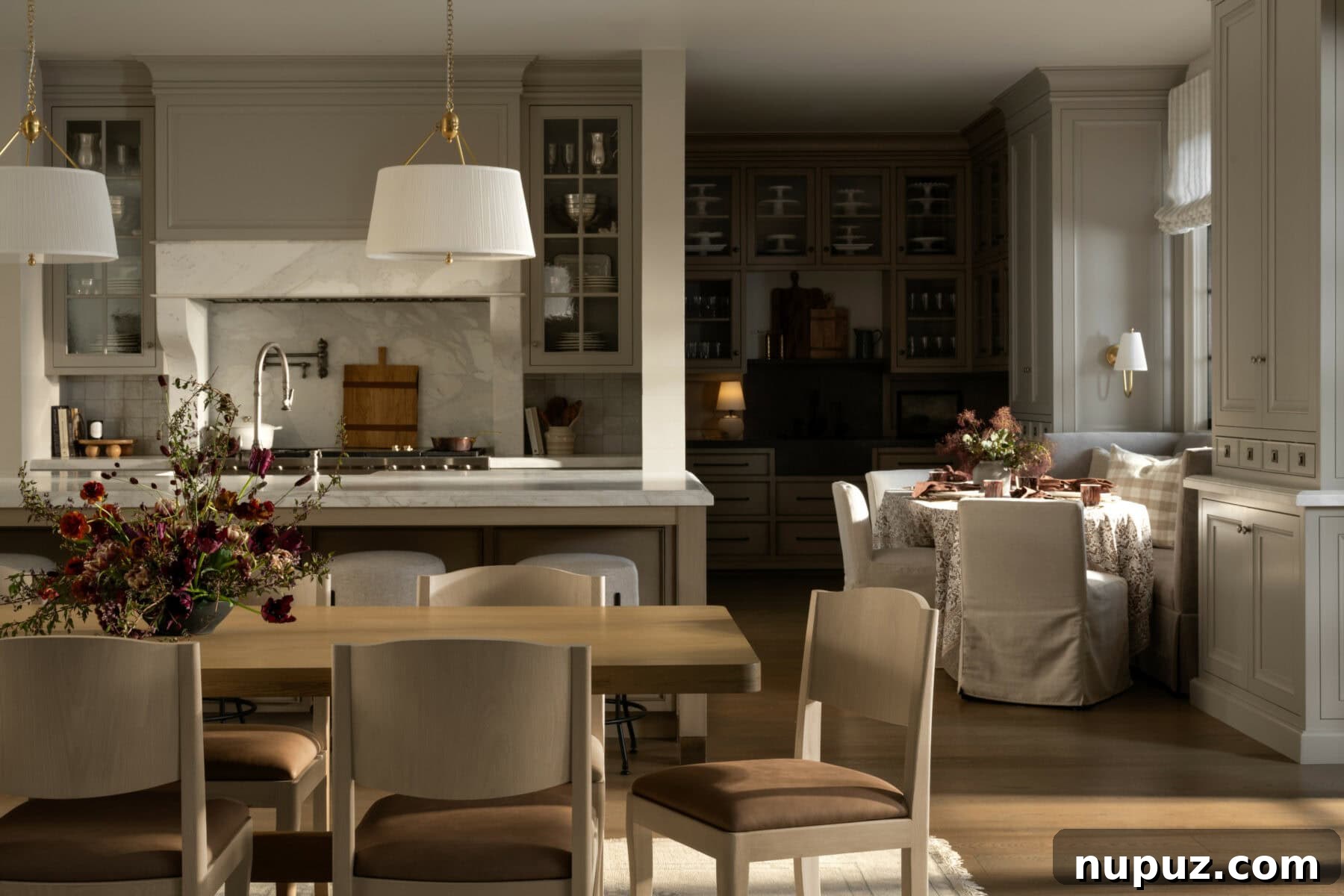 Neutral Reimagined: Beyond White 3 Elegant dining room and kitchen combination in warm neutrals, showcasing a refined yet inviting atmosphere by Studio McGee.