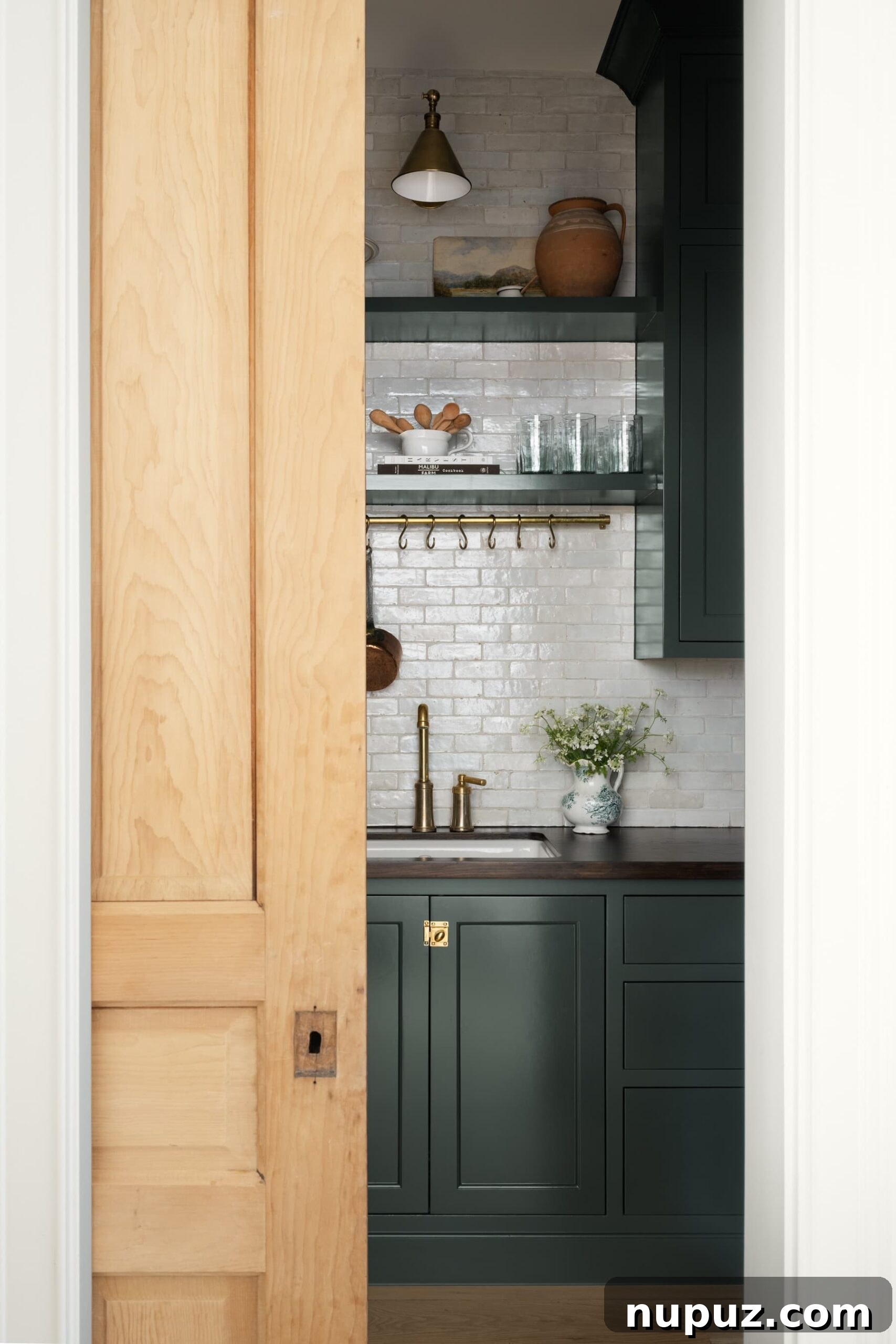 Neutral Reimagined: Beyond White 5 Butler's pantry with tile backsplash, pot hanger, and warm neutral cabinetry, designed by Studio McGee.