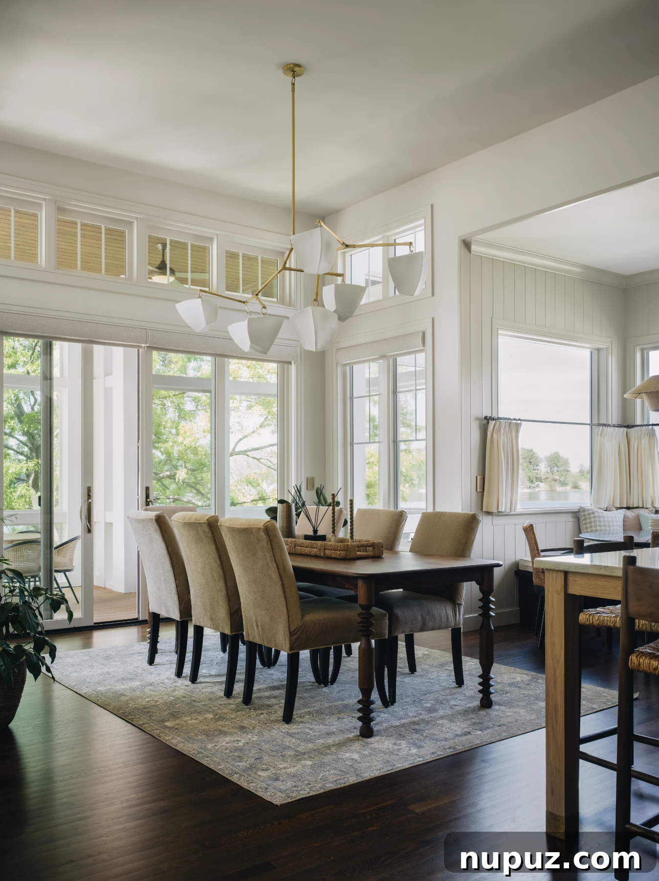 Cultivating Comfort: 15 Cozy Home Decor Ideas 4 Jean Stoffer Design creates homes with that certain undefinable something, with cozy home decor that makes a house feel like home. Stoffer Photography Interiors -dining room with beautiful statement chandelier