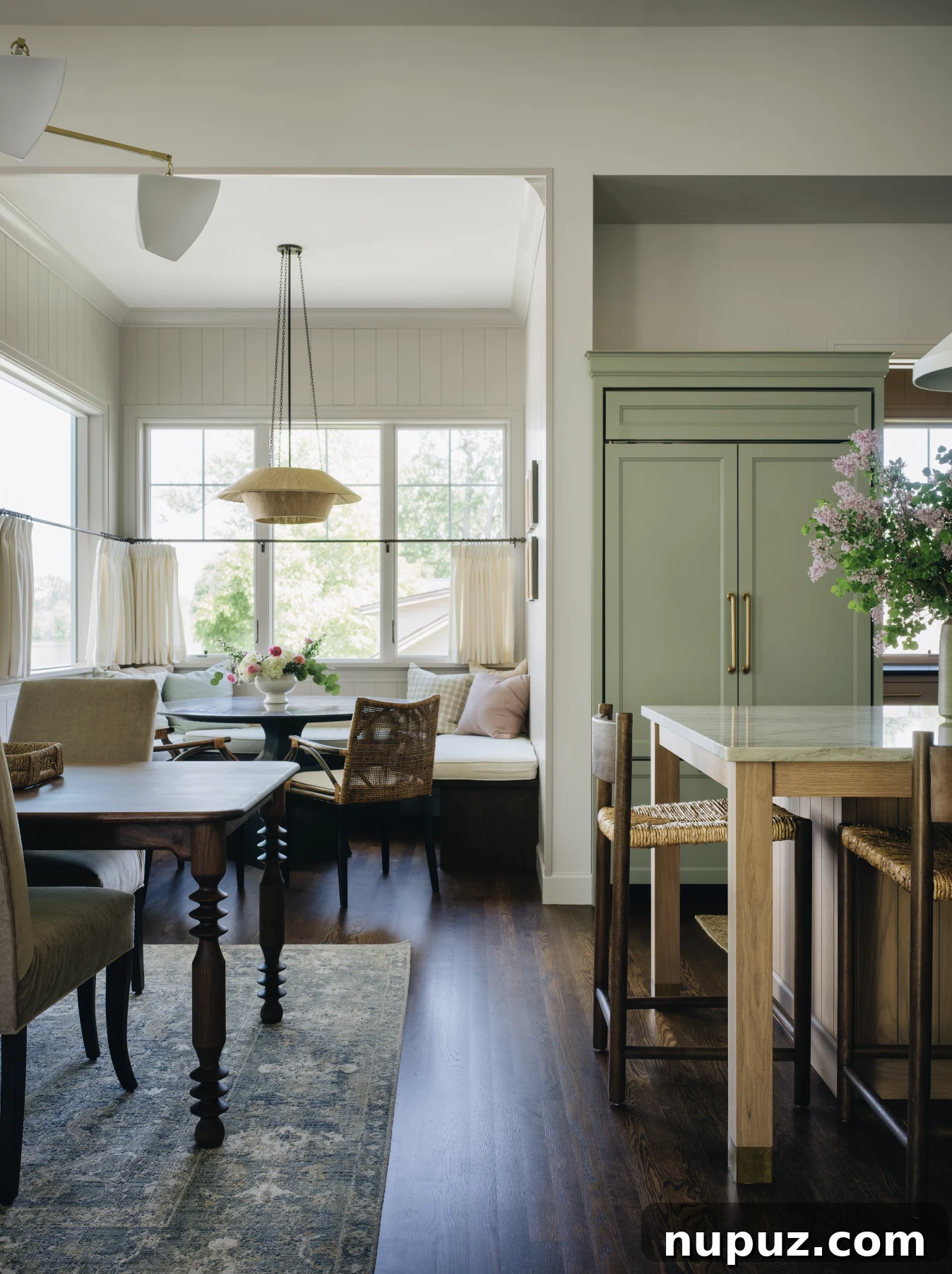 Cultivating Comfort: 15 Cozy Home Decor Ideas 5 Jean Stoffer Design creates homes with that certain undefinable something, with cozy home decor that makes a house feel like home. Stoffer Photography Interiors - love the dining nook with the banquette and round dining table