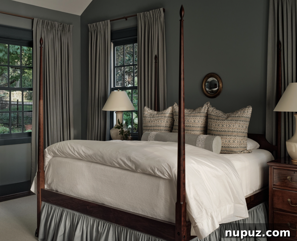 Layered and inviting bedroom design by Sabbe Interior Design, featuring comfortable bedding, cozy rugs, and special antiques that create a warm, personal atmosphere. Photographed by Joseph Bradshaw.