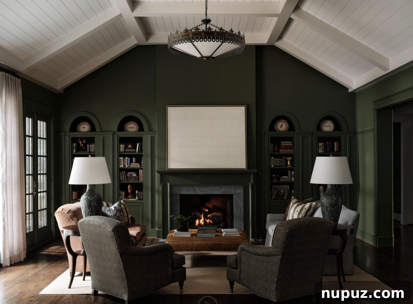 A beautiful living room in a moody green hue with a paneled ceiling, showcasing sophisticated interior design by Sabbe Interior Design and photography by Joseph Bradshaw. A prime example of an intentional, inviting space.