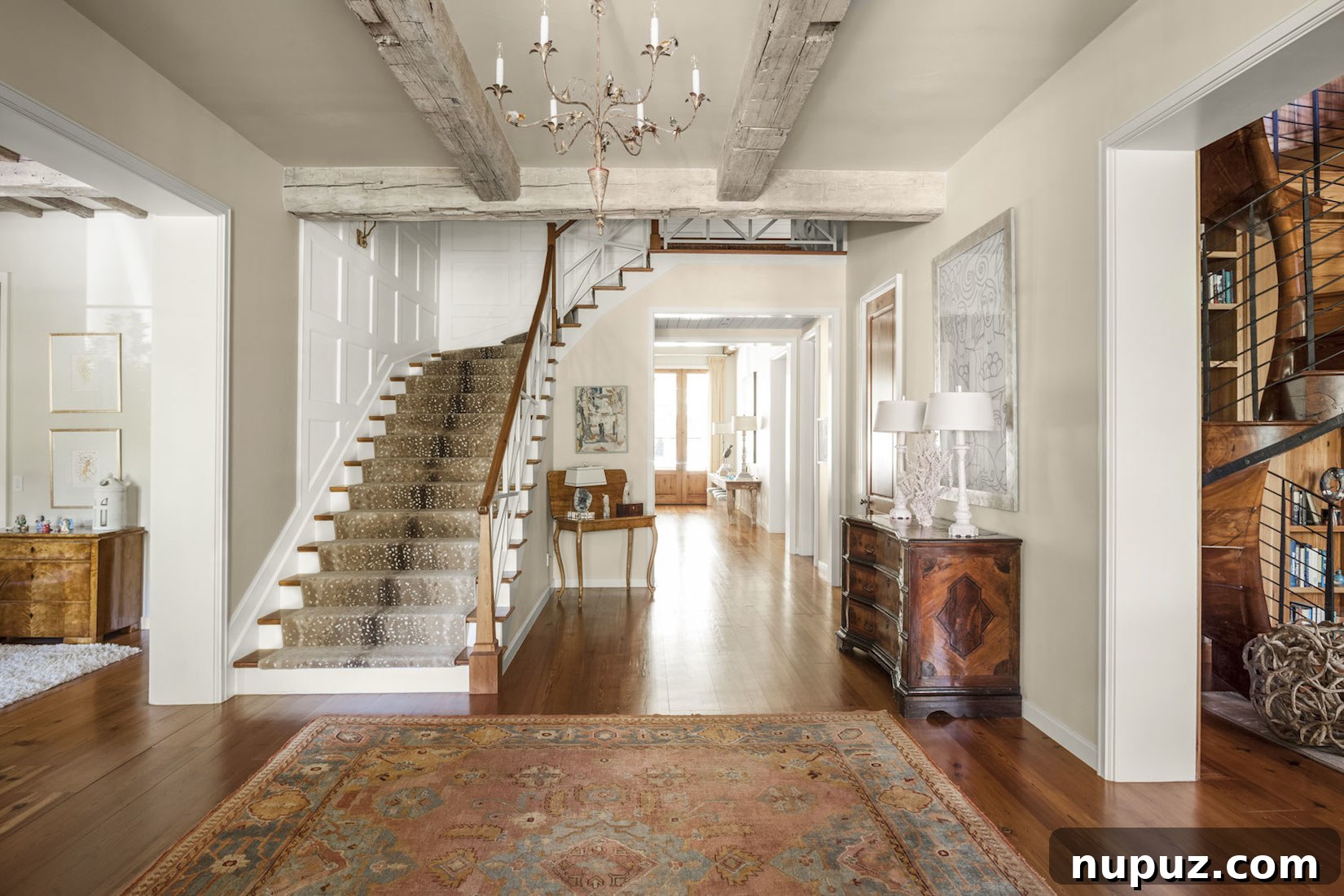 7 Entryway Transformations for an Impressive Welcome 7 Sophisticated entryway with dark paneled walls, a classic white console table, and a decorative bowl, creating a striking contrast and elegant visual appeal by Collins Interiors.