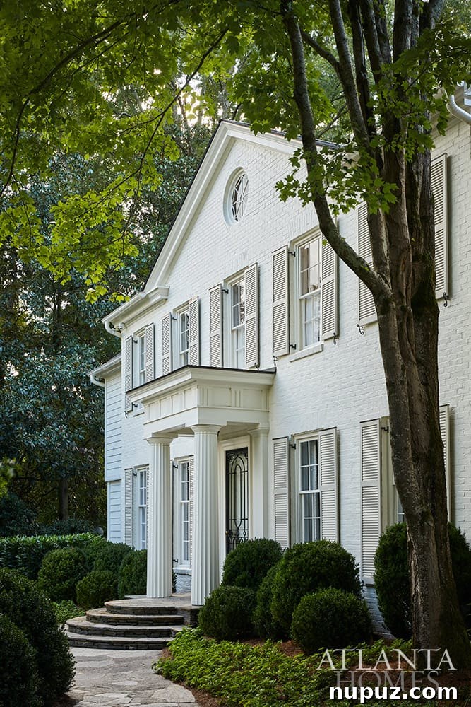 Stunning white brick Georgian estate exterior, showcasing classic architecture and impressive curb appeal