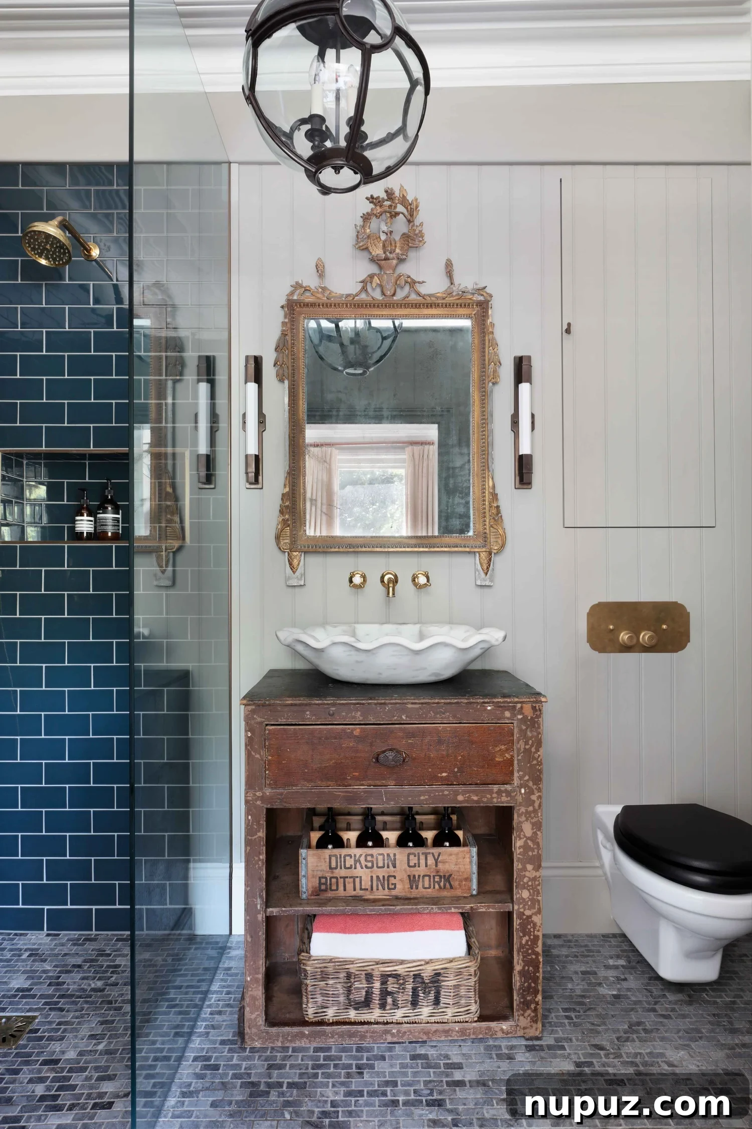 10 Steps to Your At-Home Spa Oasis 9 Unique sink bowl set atop an antique chest, complemented by a vintage brass mirror, creating a distinctive and homely spa-like atmosphere in a Hám Interiors design, by Alexander James Photography.