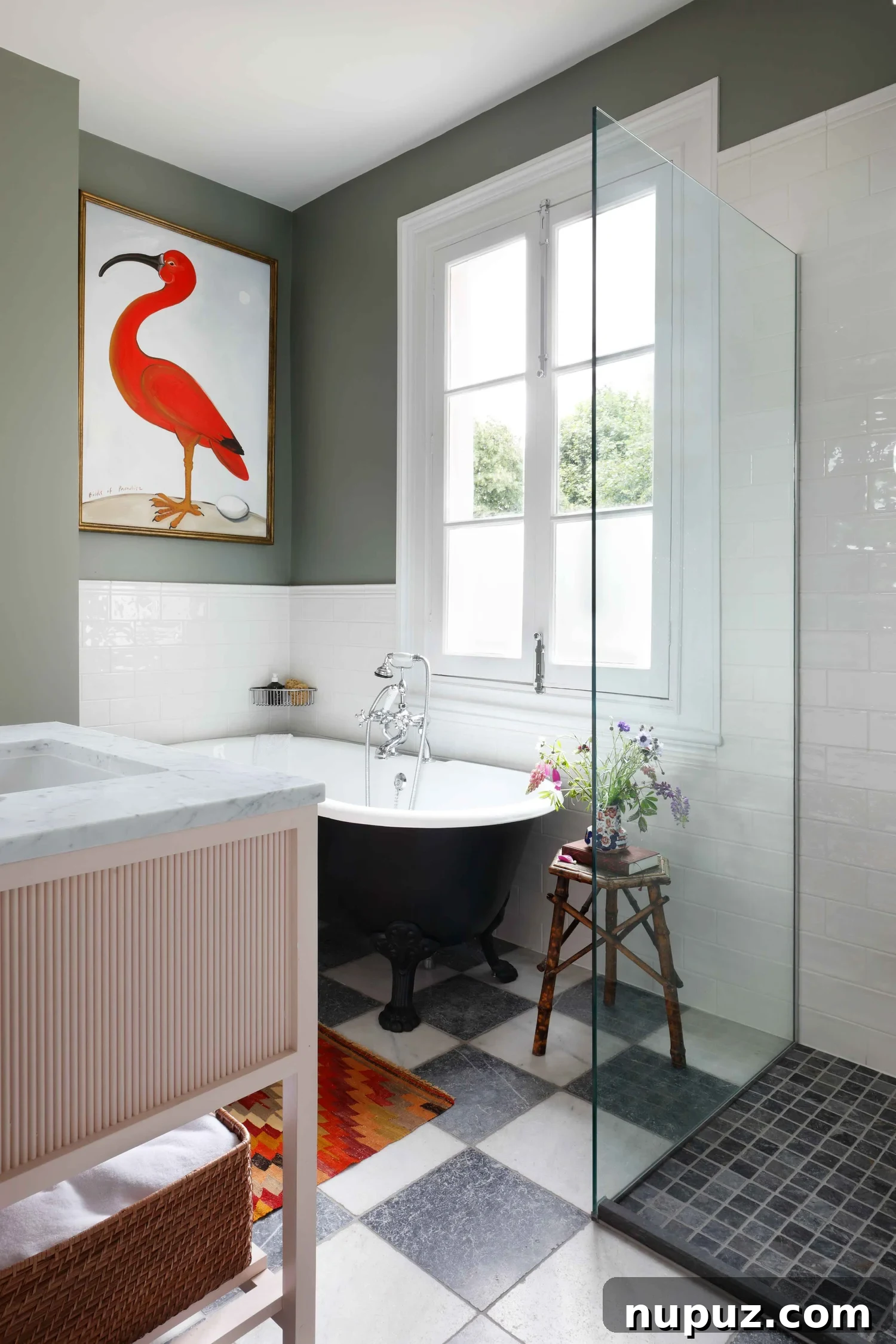 10 Steps to Your At-Home Spa Oasis 10 Striking black freestanding tub positioned under elegant spoonbill art, creating a dramatic and artistic focal point in a spa-like bathroom designed by Hám Interiors, by Alexander James Photography.