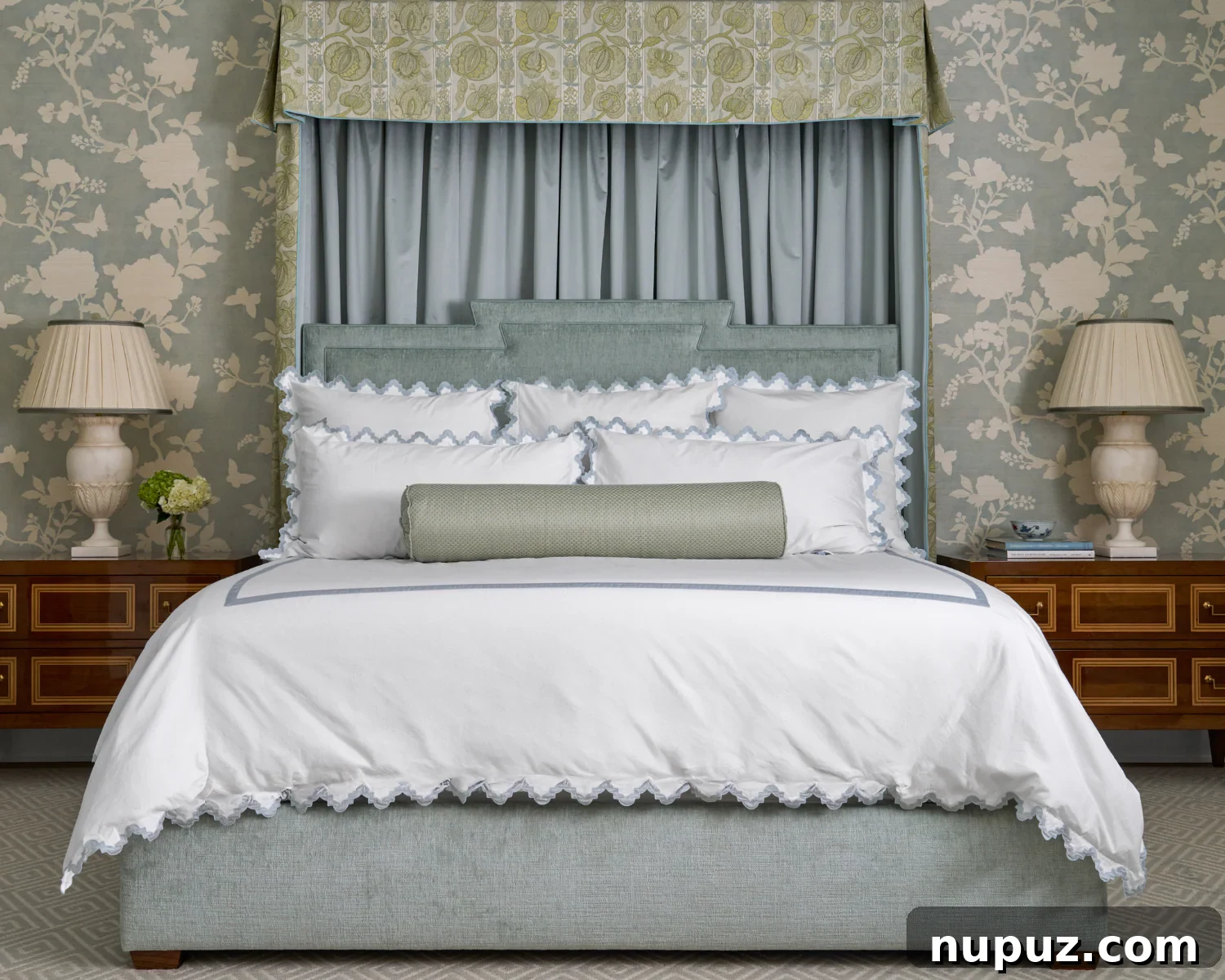 Crafting Your Sanctuary: Inspiring Home Interior Designs 11 Elegant blue and white bedroom featuring a dramatic fabric canopy bed, creating a focal point and luxurious retreat