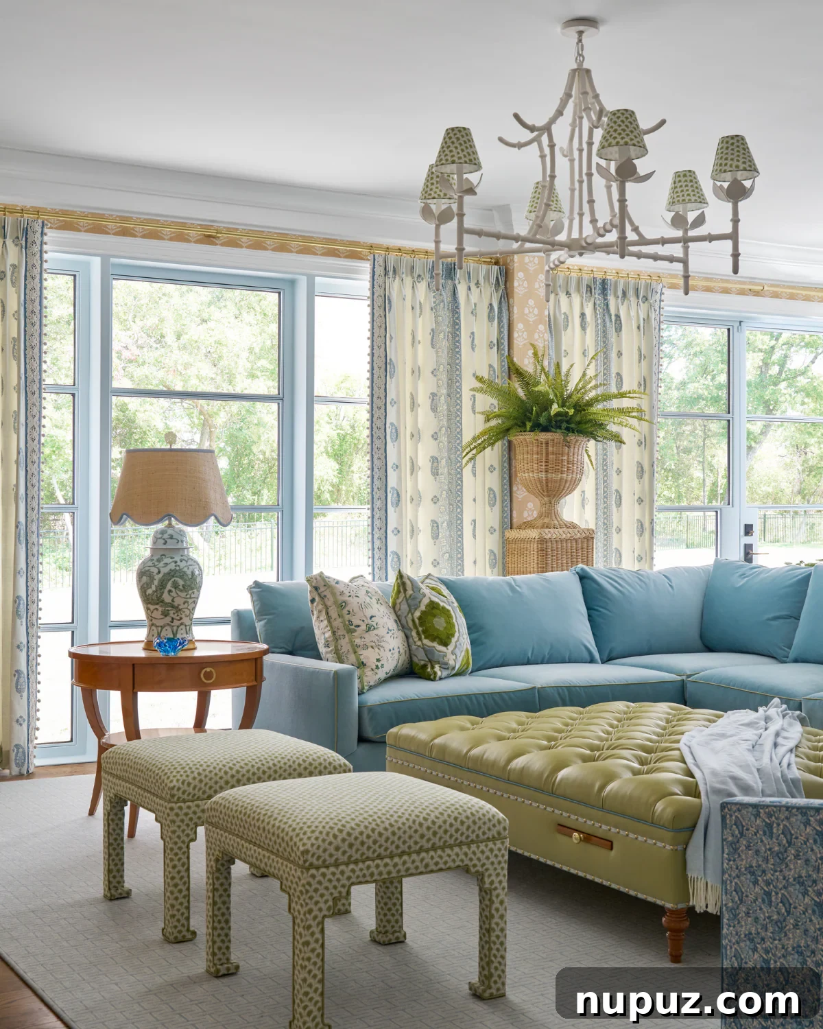 Crafting Your Sanctuary: Inspiring Home Interior Designs 4 Inviting living room featuring a large sectional sofa, a tufted green leather ottoman, and a vibrant blue and white color scheme