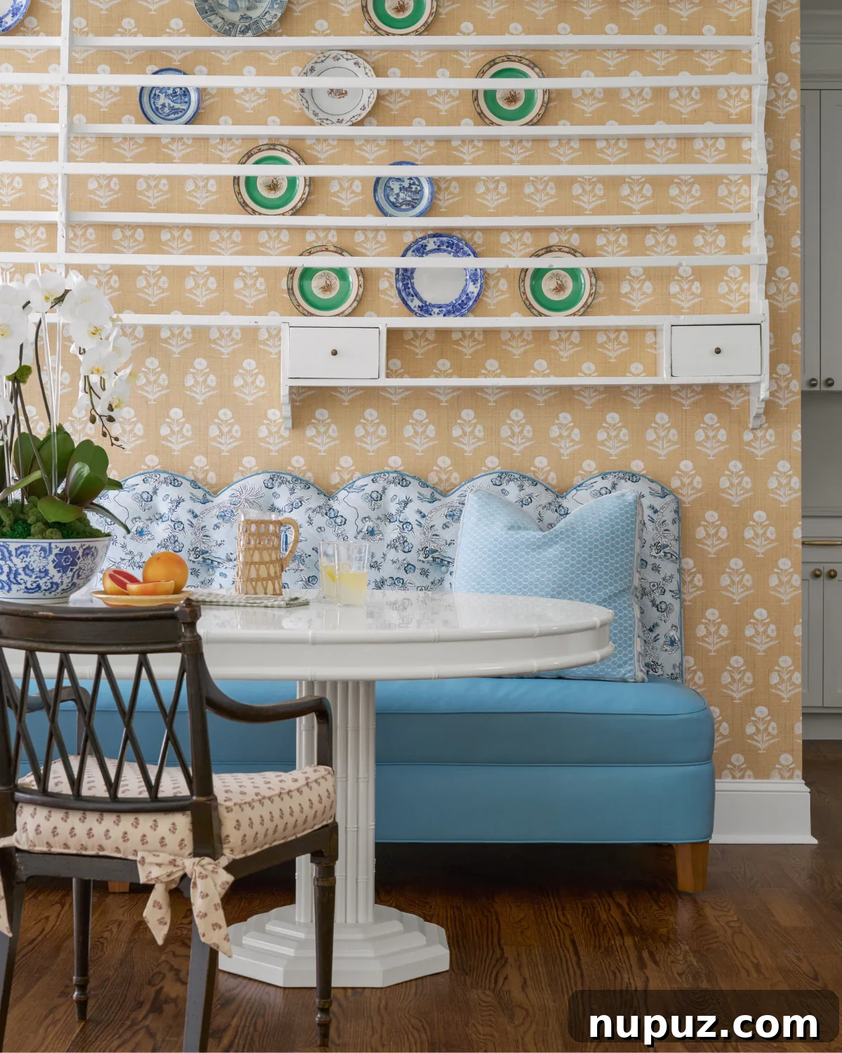 Crafting Your Sanctuary: Inspiring Home Interior Designs 6 Charming dining nook with a scalloped banquette seating, built-in plate rack, and classic interior design details