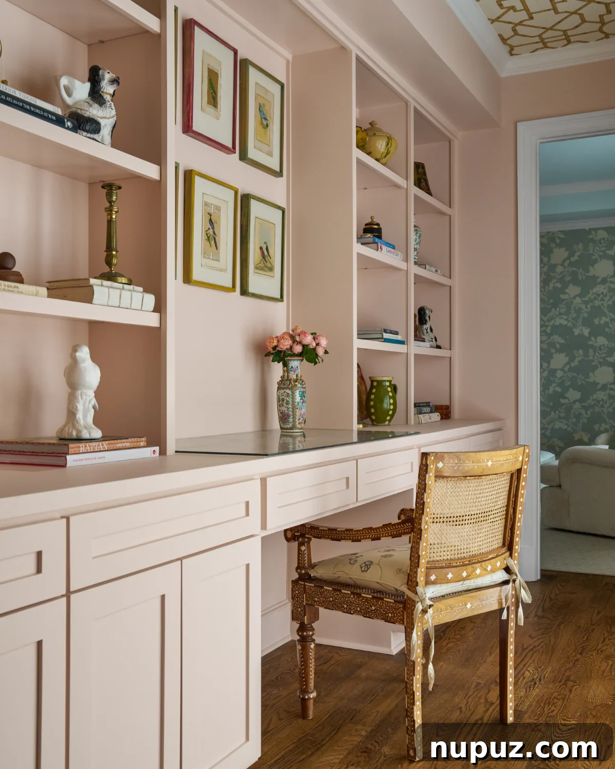 Crafting Your Sanctuary: Inspiring Home Interior Designs 9 Serene bedroom sitting area with a soft pink color palette, elegant chair, and a distinctive wallpaper applied to the ceiling