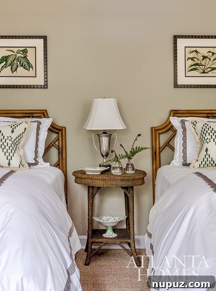 Stunning Atlanta Home Interiors 11 A primary bedroom designed for comfort and elegance, featuring a stylish chair and a bamboo chest, enhancing the serene and inviting ambiance.