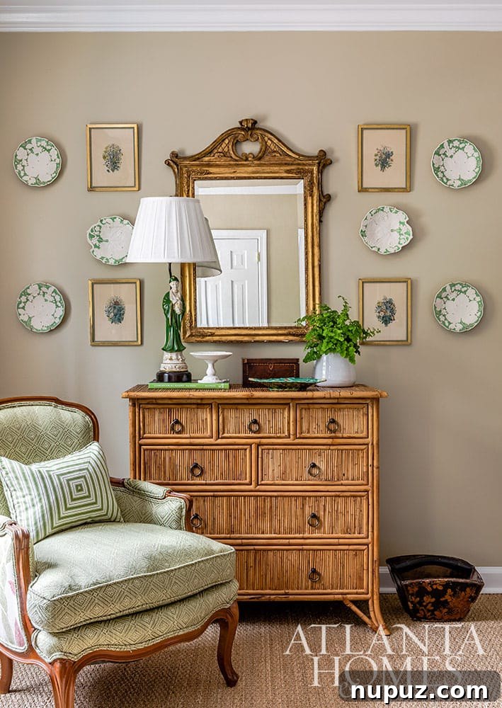 Stunning Atlanta Home Interiors 12 A beautifully appointed bedroom featuring a comfortable bench at the foot of the bed and a pair of elegant chairs situated in a charming bow window, creating a perfect seating area.