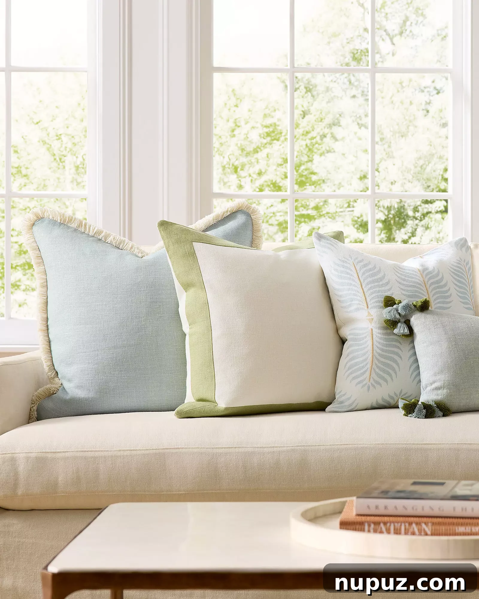Spring Awakening: 5 Simple Decor Ideas for an Instant Home Transformation 4 A stylish sofa adorned with new throw pillows and a draped throw, adding a dash of spring color and texture to the room.