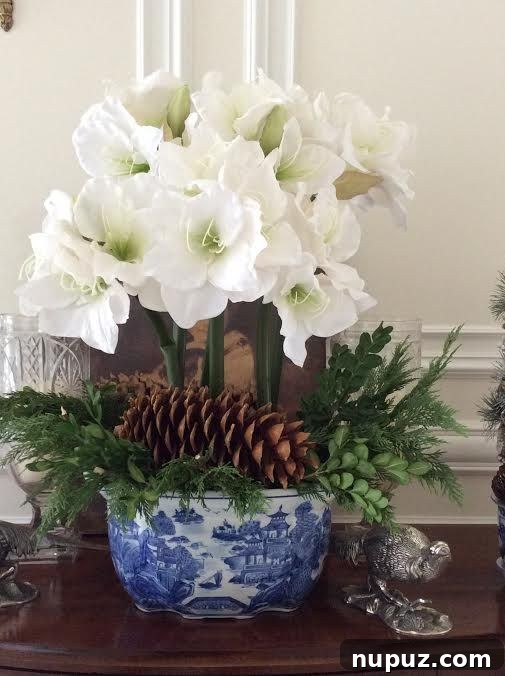 The Enchanted Home's Blue and White Spell 6 Stunning white floral arrangement in a classic blue and white vase