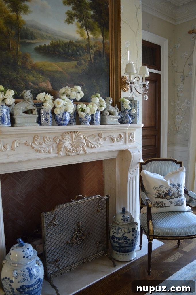 The Enchanted Home's Blue and White Spell 9 Blue and white mantel decor with seasonal flowers in various sized jars