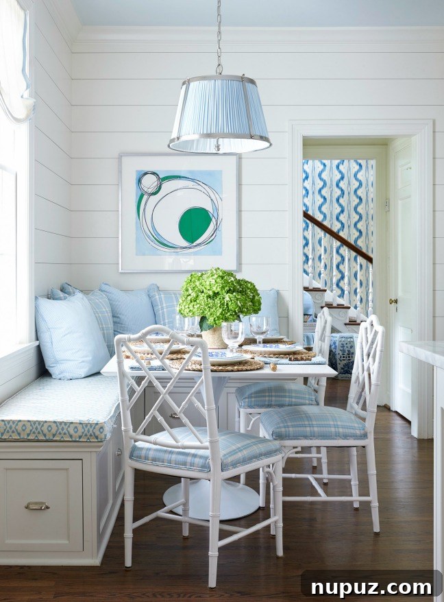 Sarah Bartholomew's cozy dining nook featuring elegant bamboo chairs, a round table, and a serene blue color scheme.