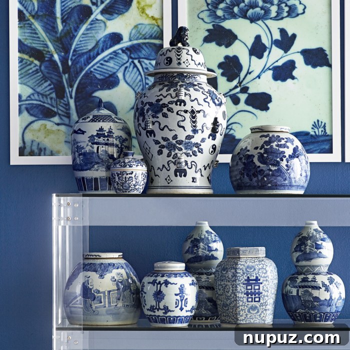 A collection of exquisite blue and white decorative accents, including ginger jars and ceramic vases, often associated with Wisteria's timeless collection.