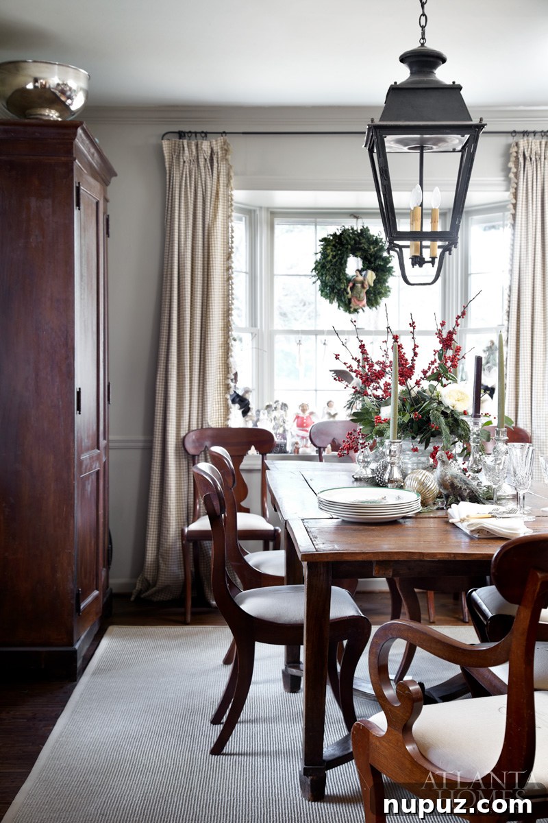 Buckhead home interior showcasing a beautifully adorned Christmas tree in a room with warm lighting and classic furniture.