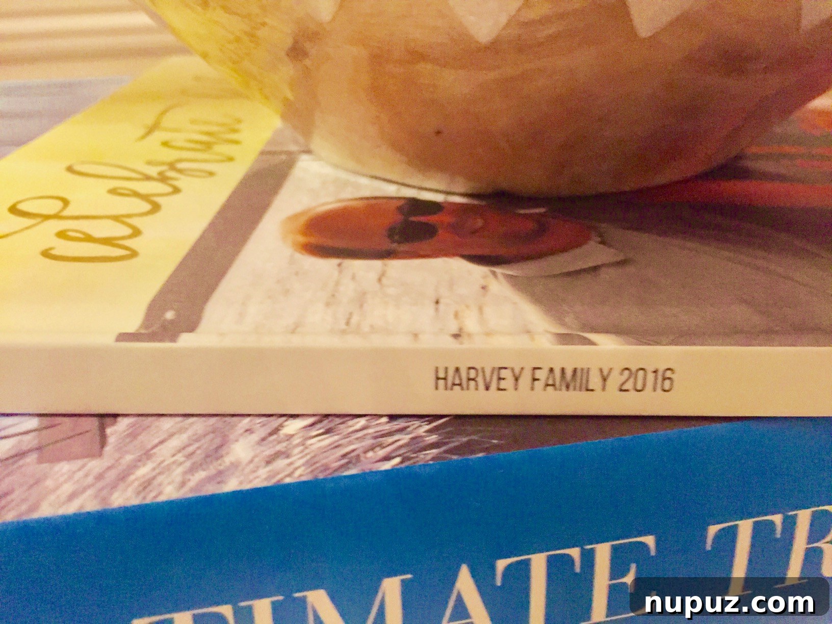 A stunning spread in a Mixbook photo album, displaying a vibrant collage of happy family moments and holiday memories
