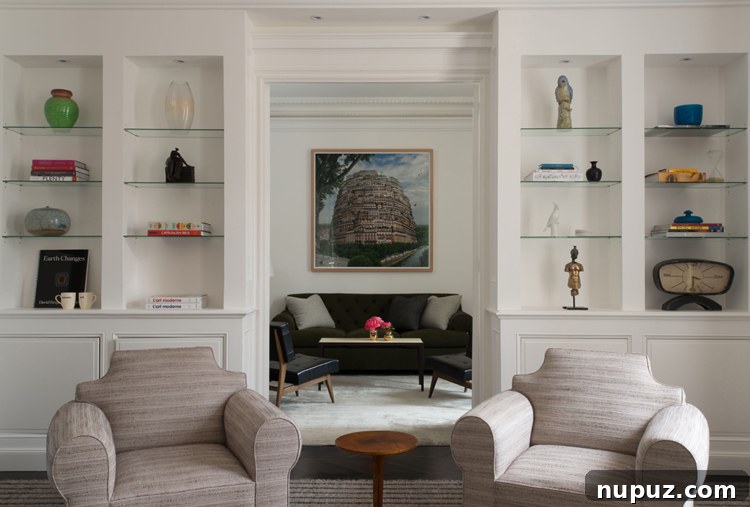 Timothy Brown Studio: Elevated Aesthetics 7 Spacious living room with a large sectional sofa, elegant coffee table, and natural light