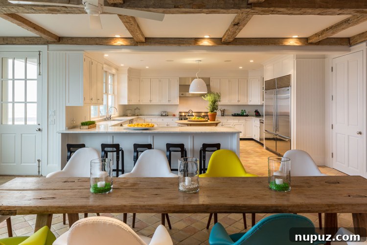Timothy Brown Studio: Elevated Aesthetics 9 Open concept living space with a large sofa, dining area, and abundant natural light, perfect for entertaining