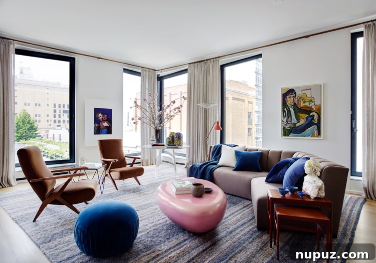 Timothy Brown Studio: Elevated Aesthetics 10 Stylish living room with curved sectional seating arranged for conversation, overlooking large windows